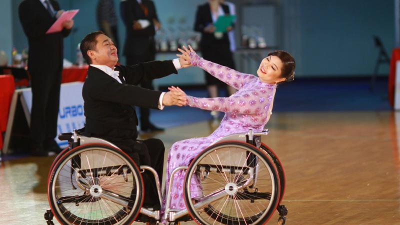 Wheelchair dancer partners competing in an event