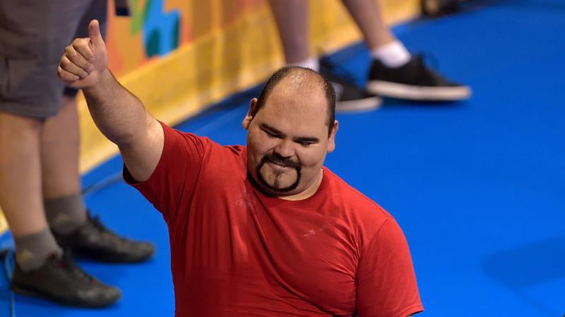 Jose Castillo Castillo gives a thumbs up to the audience after a competition 