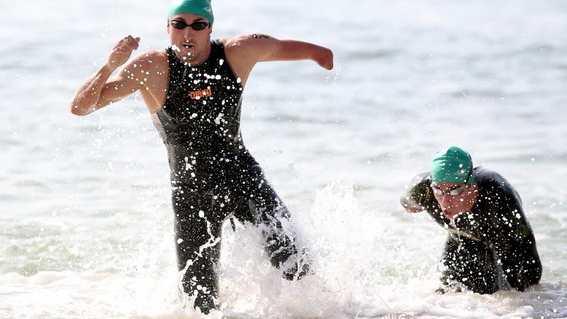 Martin Schulz of Germany emerges from the water in the swim portion of the men's PT4 class during the Aquece Rio Paratriathlon at Copacabana beach.