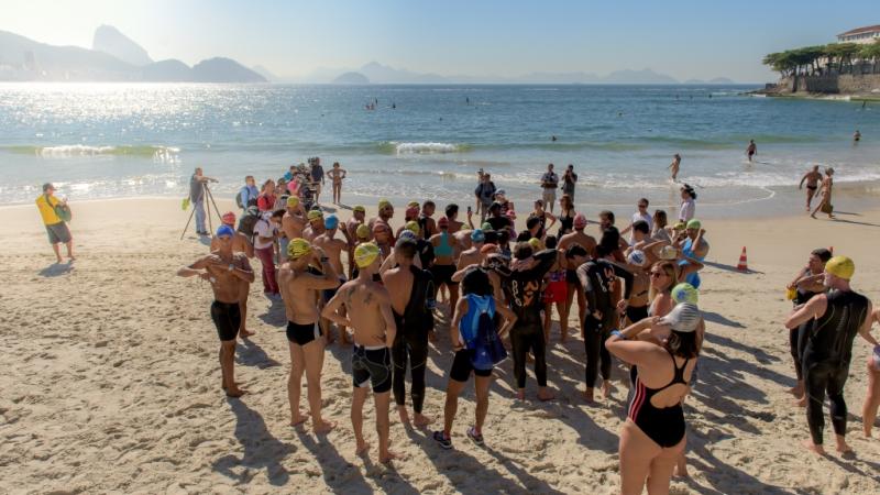 Group of athletes on the beach, duscussing