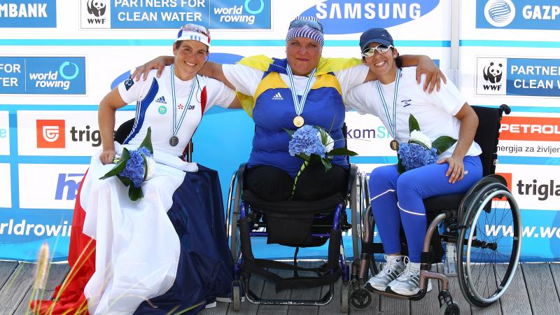 Three women smiling. 