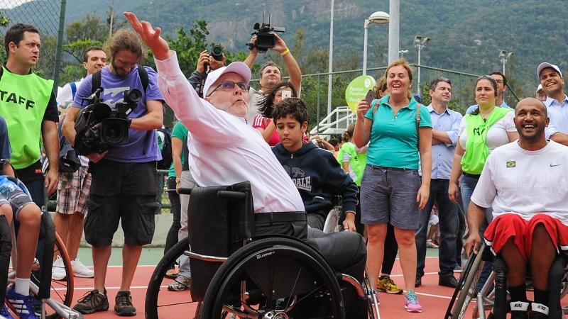 IPC president Sir Philip, a five-time Paralympian in wheelchair basketball, shows them how it's done.