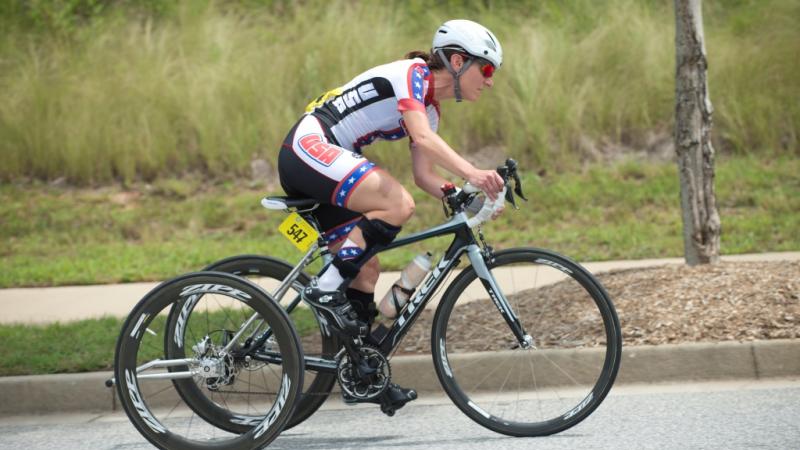 Woman on bike competing