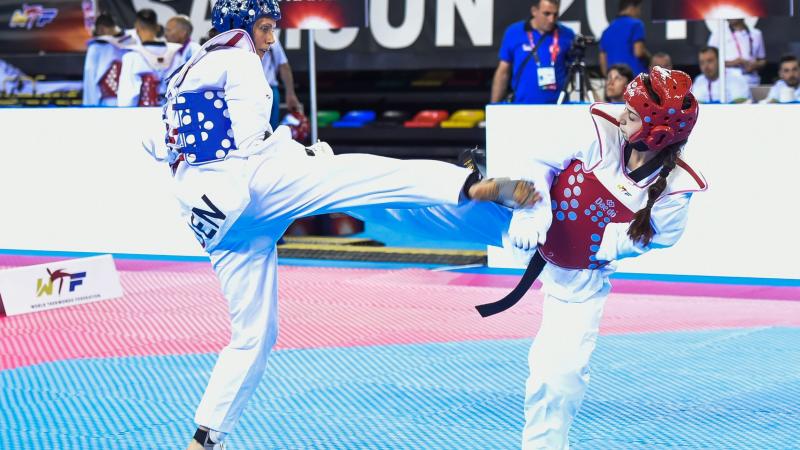 Two athletes doing taekwondo