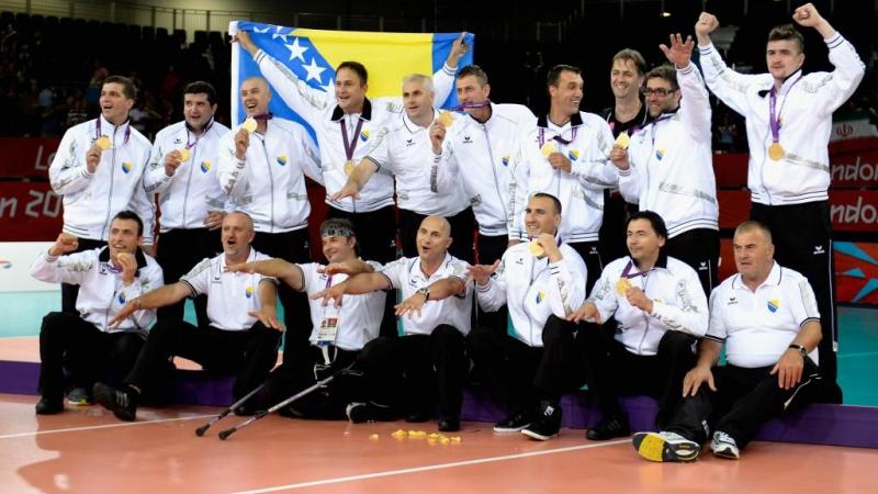 The team of Bosnia and Herzegovina celebrates after winning the gold in the Men's Sitting Volleyball competition at the London 2012 Paralympic Games.