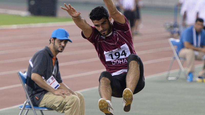 Man doing long jump