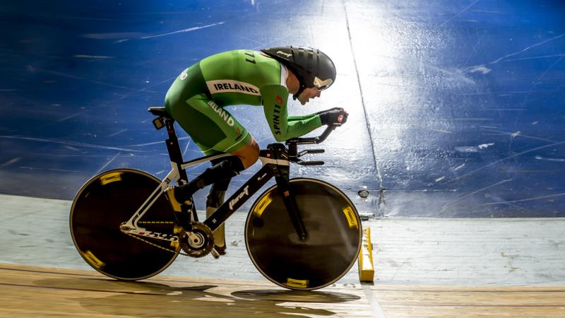 Man on a bike, cycling on a track