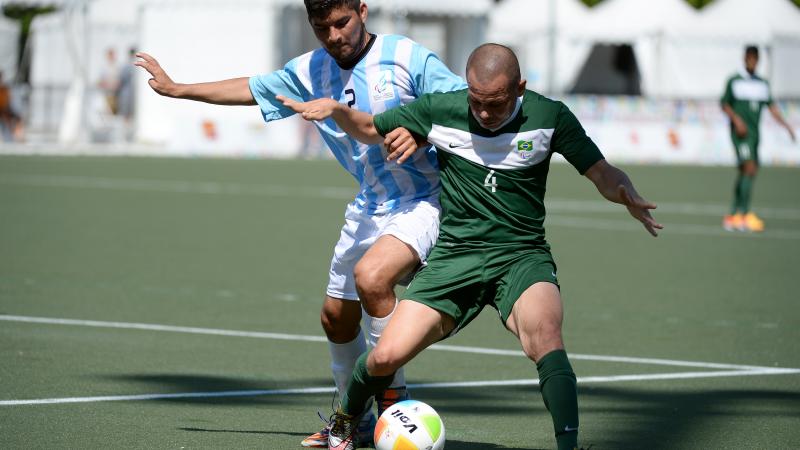 Rodrigo Luquez of Argentina and Jose Monteiro Guimaraes of Brazil in the football 7-a-side gold medal game at the Toronto 2015 Parapan American Games.