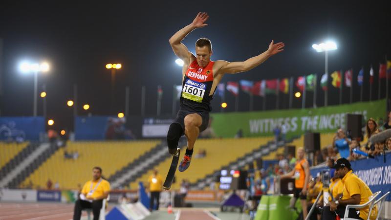 Man with prosthesis during a jump