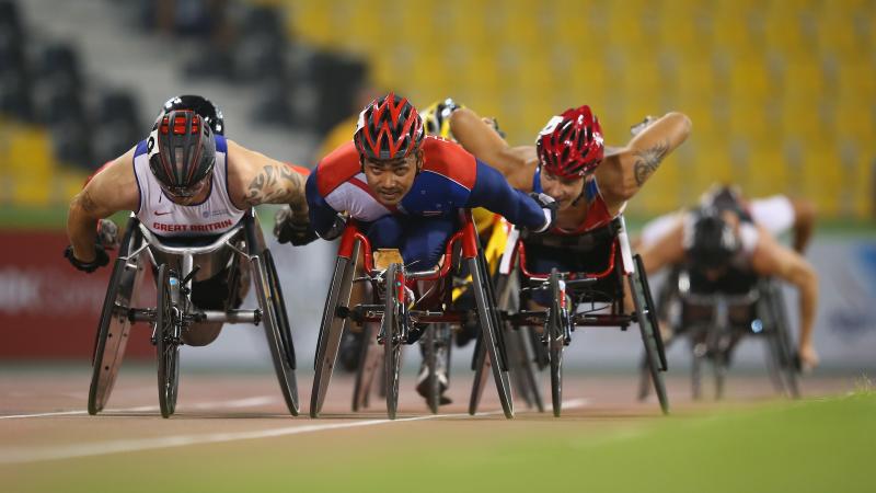 Field of wheelchair racers on track