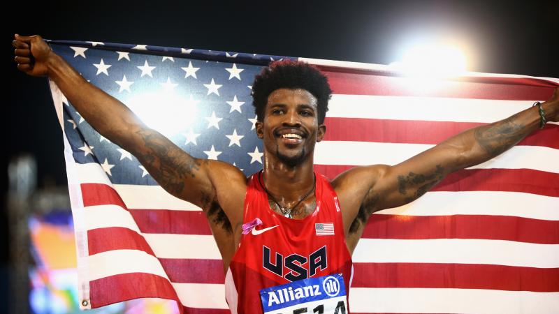 Man holding up an American flag