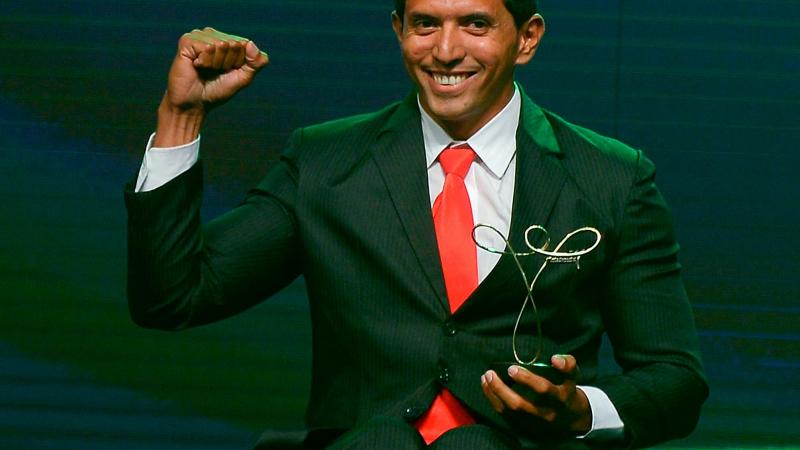 Luis Carlos Cardoso da Silva poses with his trophy won in the Paracanoe category of the Brazil Paralympics 2014 Awards Ceremony.