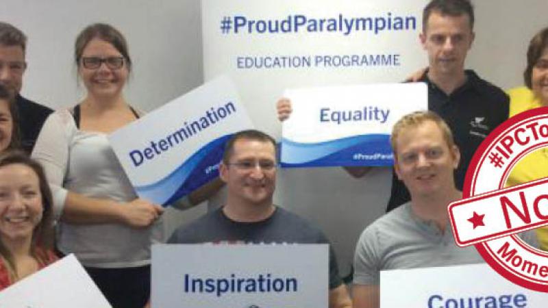 Group shot of young people holding signs with words on it (inspiration, courage)