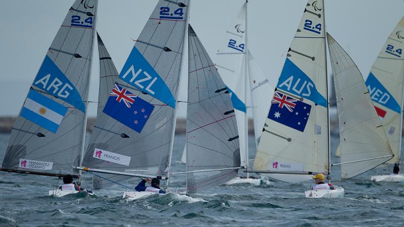 Three sailing boats on the water