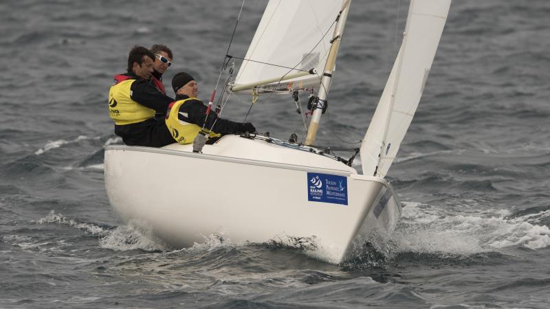 Three men sailing