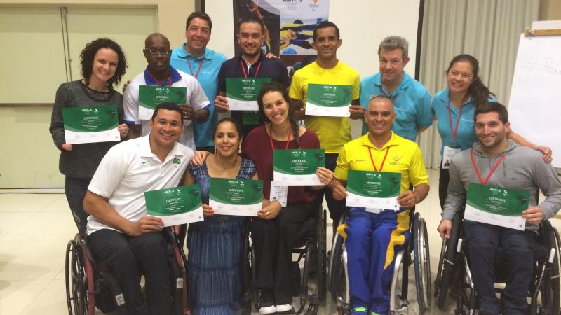 Paralympians show-off their certificates after being trained to be leaders in the Paralympic Movement