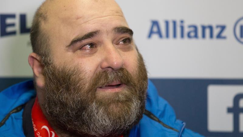 Pavlos Mamalos - 2015 IPC Powerlifting European Open Championships Portrait photo of a man with a beard