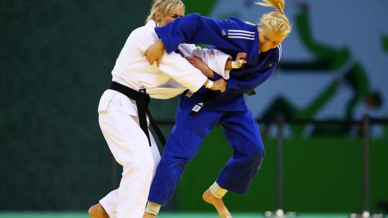 Maryna Cherniak of Ukraine (blue) and Eva Cseroviczki of Hungary (white) compete during the Women's Judo -48kg bronze medal match on day thirteen of the Baku 2015 European Games.