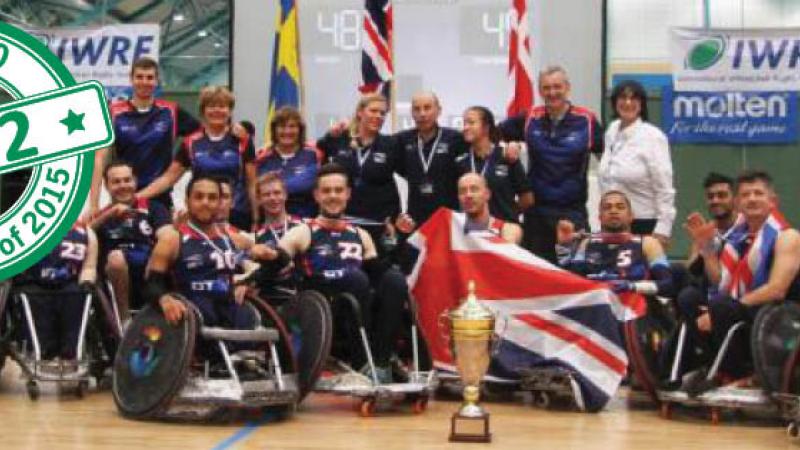 Group picture of people in wheelchairs, showing a cup