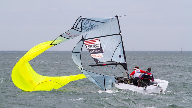 Boat on the water with a broken mast