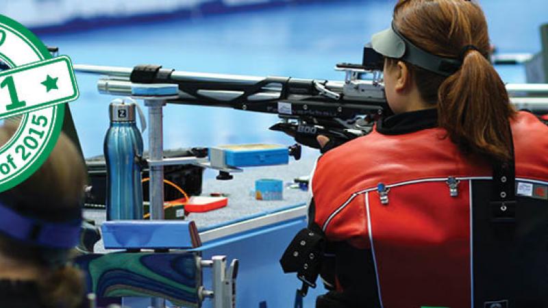 Women from the back, targeting with a rifle