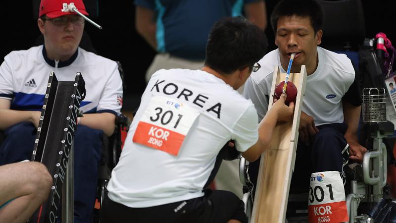 2 men playing Boccia