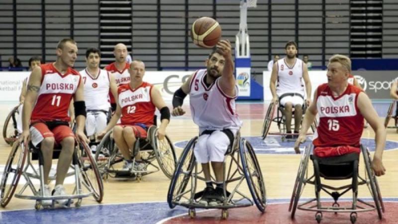 Man in wheelchair with basketball
