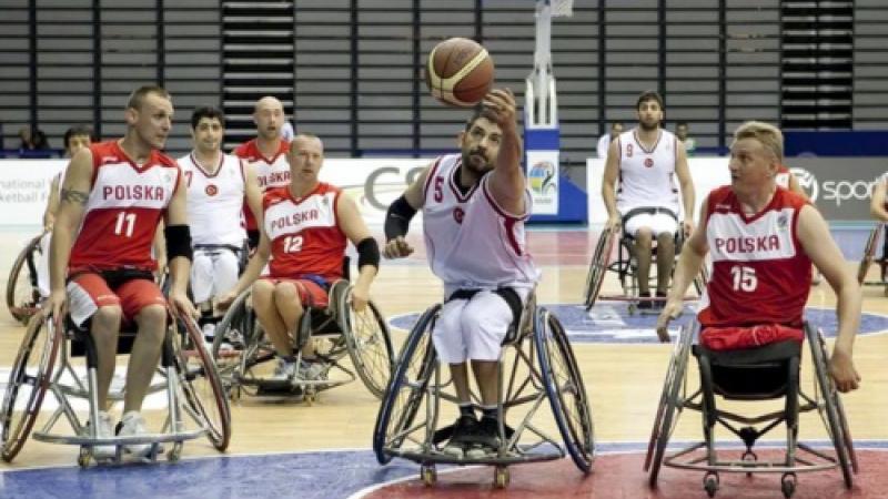 Man in wheelchair with basketball