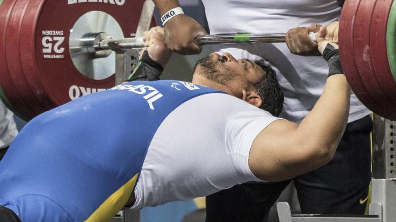A powerlifter prepares to take the strain
