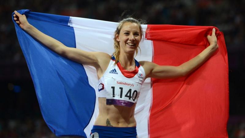 A picture of a woman on a track with the french flag