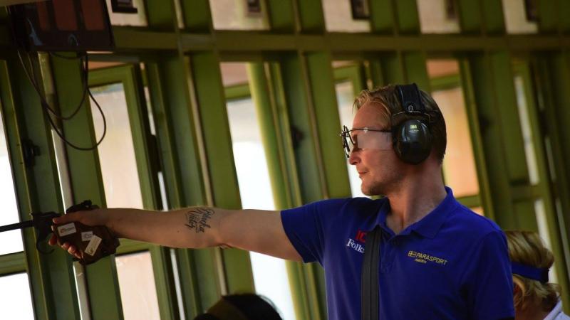 A man shooting a pistol