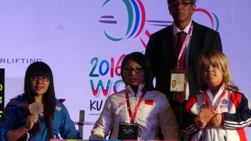 Podium of women posing for a winner picture