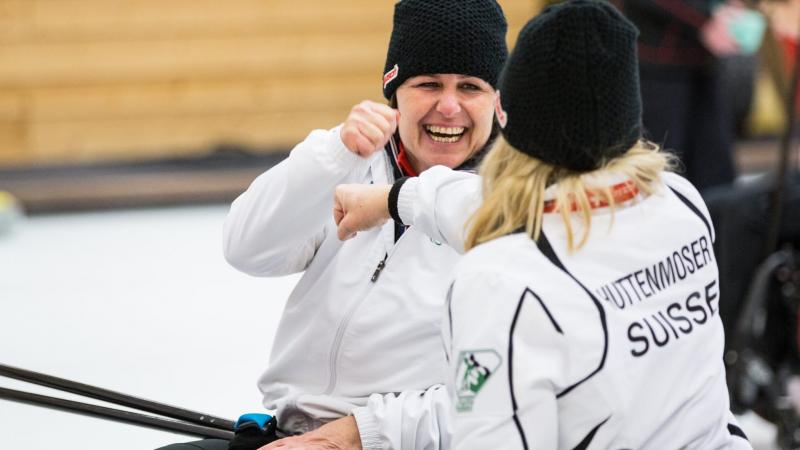 Wheelchair curlers in action