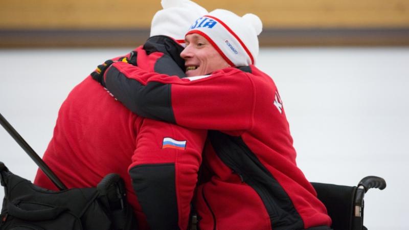 A Russian wheelchair curler celebrates progressing to the gold medal game