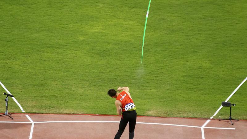 A para-athlete throws a javelin