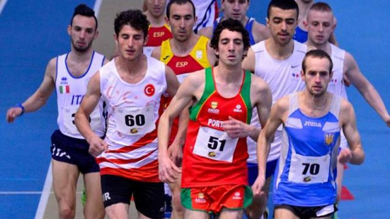 Group of men running on an indoor