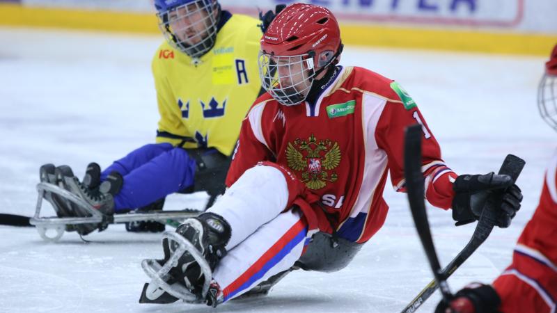Ice sledge hockey players battle it out