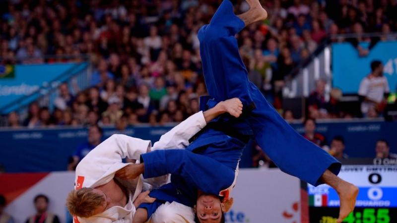 Eduardo Avila Sanchez of Mexico and Dmytro Solovey of Ukraine compete in the Men's 73kg Judo Semifinals at the London 2012 Paralympic Games. 