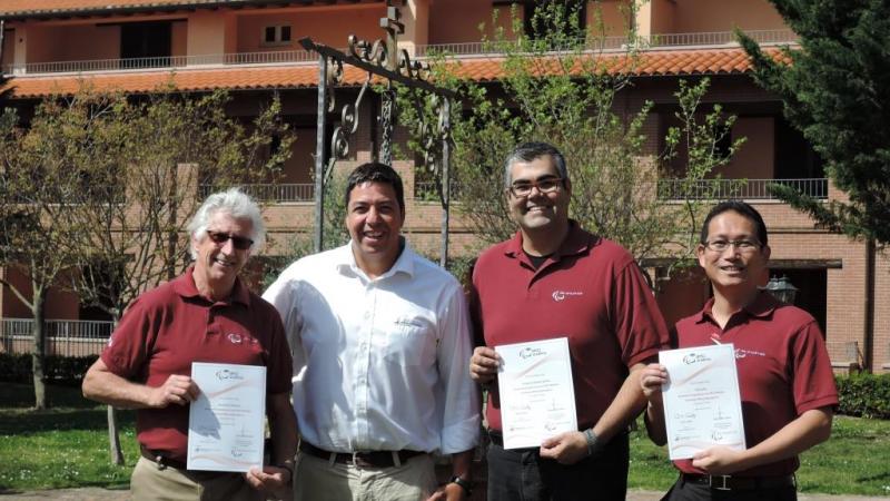 Newly trained Educators David Weicker, Frederico Nantes and Yukio Seki receive their course certificates from Flavio Santos