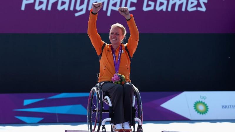 Esther Vergeer of Netherlands with her gold medal after defeating Aniek Van Koot of Netherlands in the final of the Women's singles match in the Wheelchair Tennis at the London 2012 Paralympic Games.