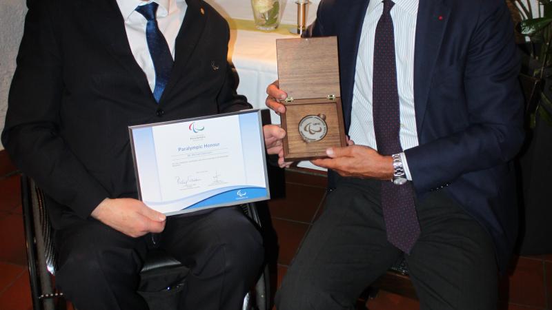 The former CEO of Allianz, Michael Diekmann, receives the Paralympic Honour from IPC President Sir Philip Craven on 15 April 2016.