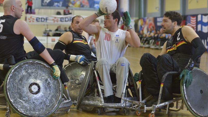 German wheelchair rugby players swarm a Danish player