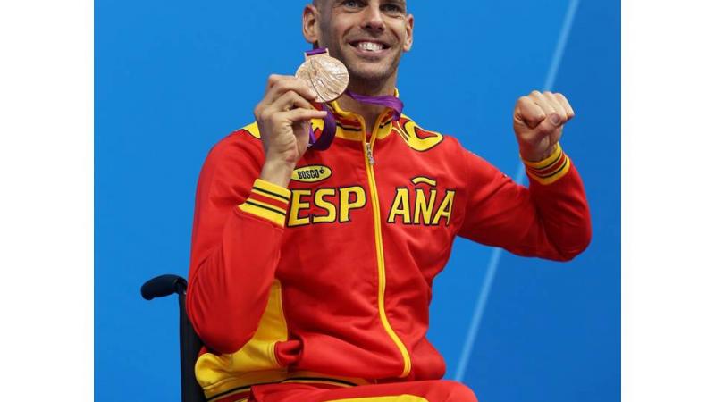 Bronze medallist Richard Oribe of Spain poses on the podium during the medal ceremony for the Men's 200m Freestyle - S4 final at the London 2012 Paralympic Games.