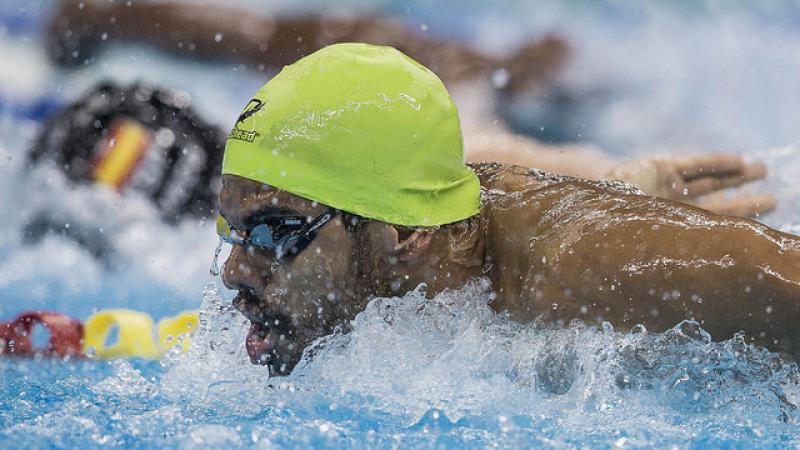 A para-swimmer competes hard