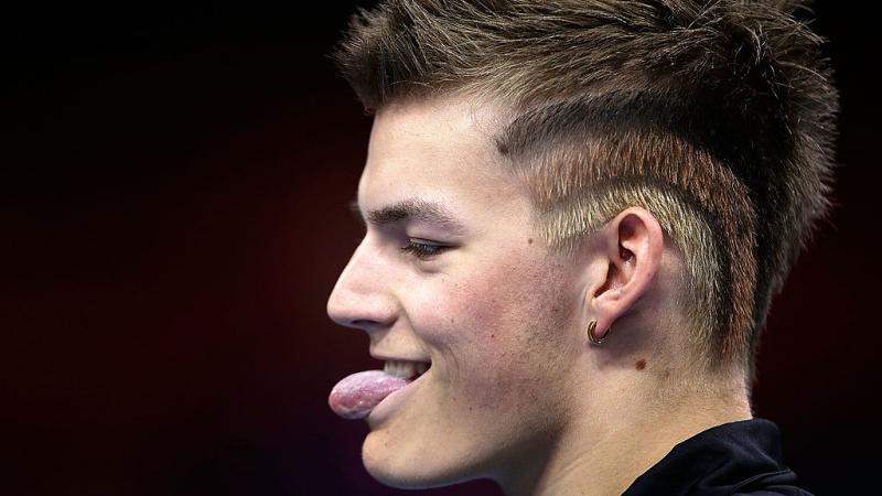 Portrait picture of a man showing his tongue.