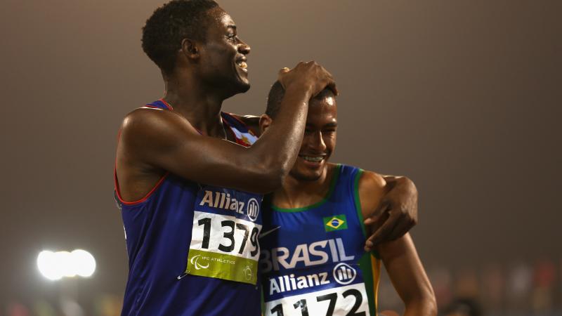 Brazil's Daniel Martins celebrates winning the men's 400m T20 final with Graclino Tavares Barbosa of Cape Verde during the 2015 IPC Athletics World Championships.