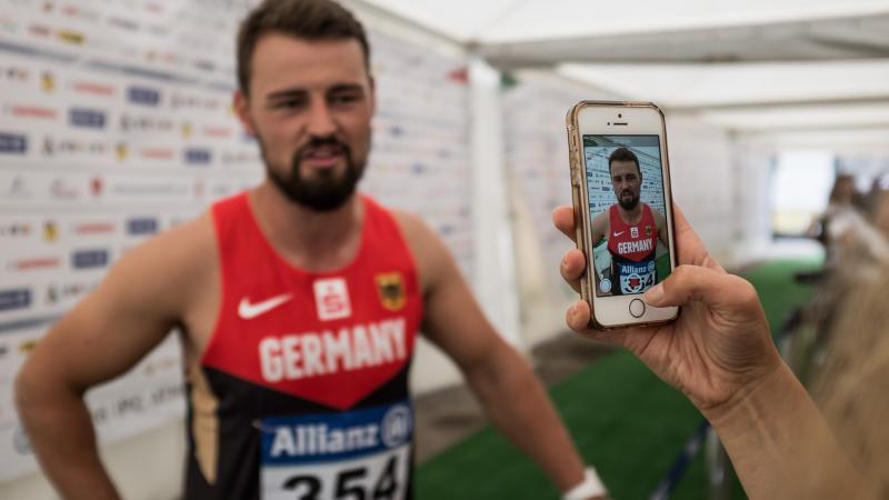 Man being filmed by a smartphone