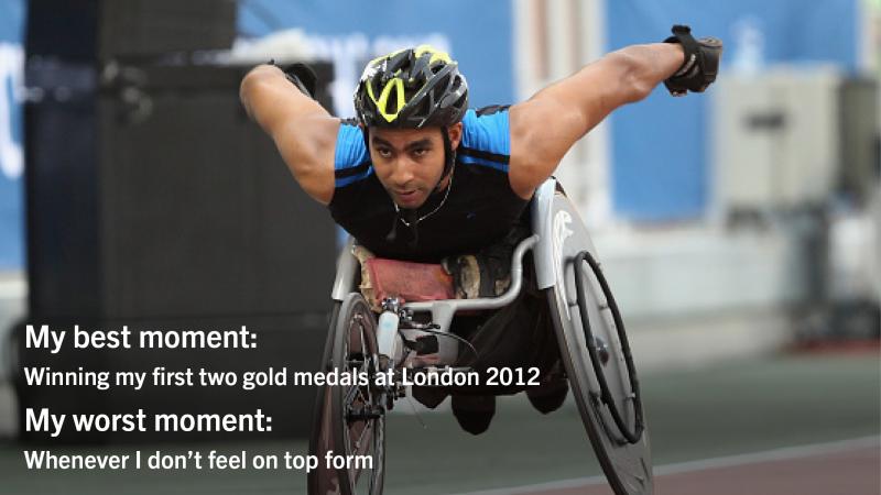 Man with helmet racing in a wheelchair