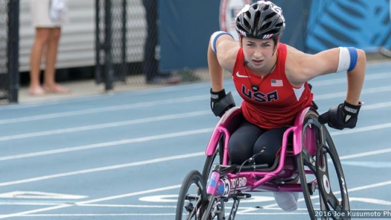Woman in racing wheelchair