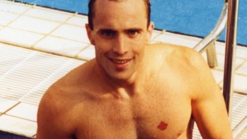 Canadian swimmer Michael Edgson stands next to the pool after competing at Barcelona 1992.